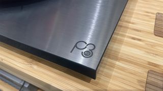 Rega Planar 3 RS Edition turntable corner detail showing logo