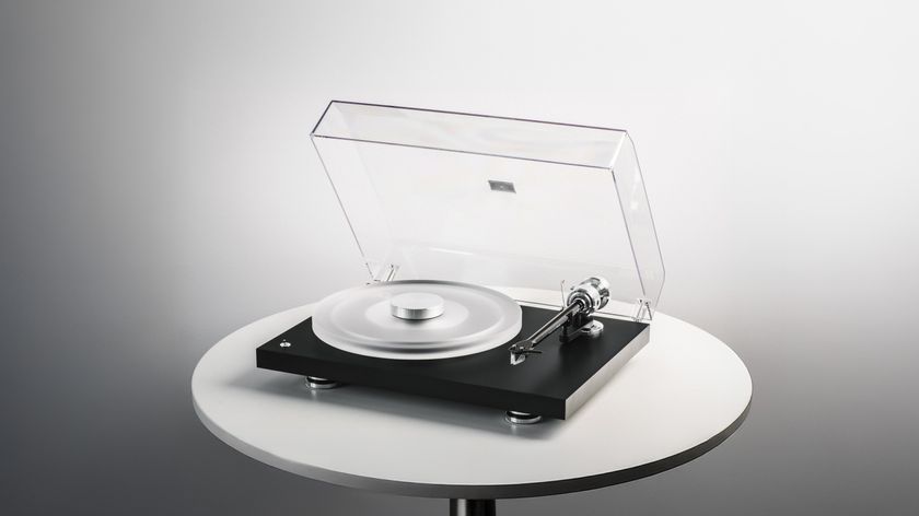 Pro-Ject Debut Reference 10 turntable sitting on a round table