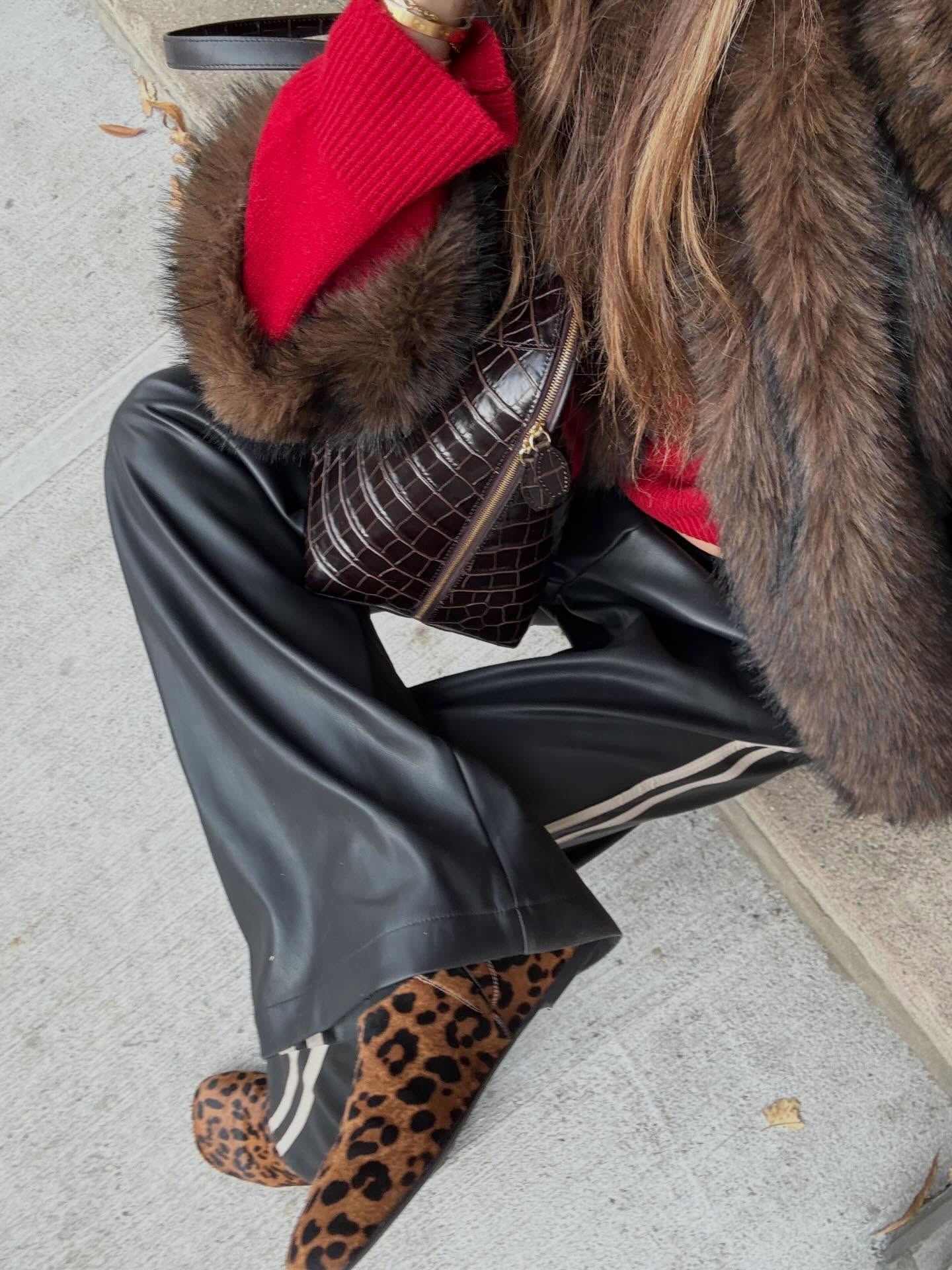 Woman in leopard shoes and black pants