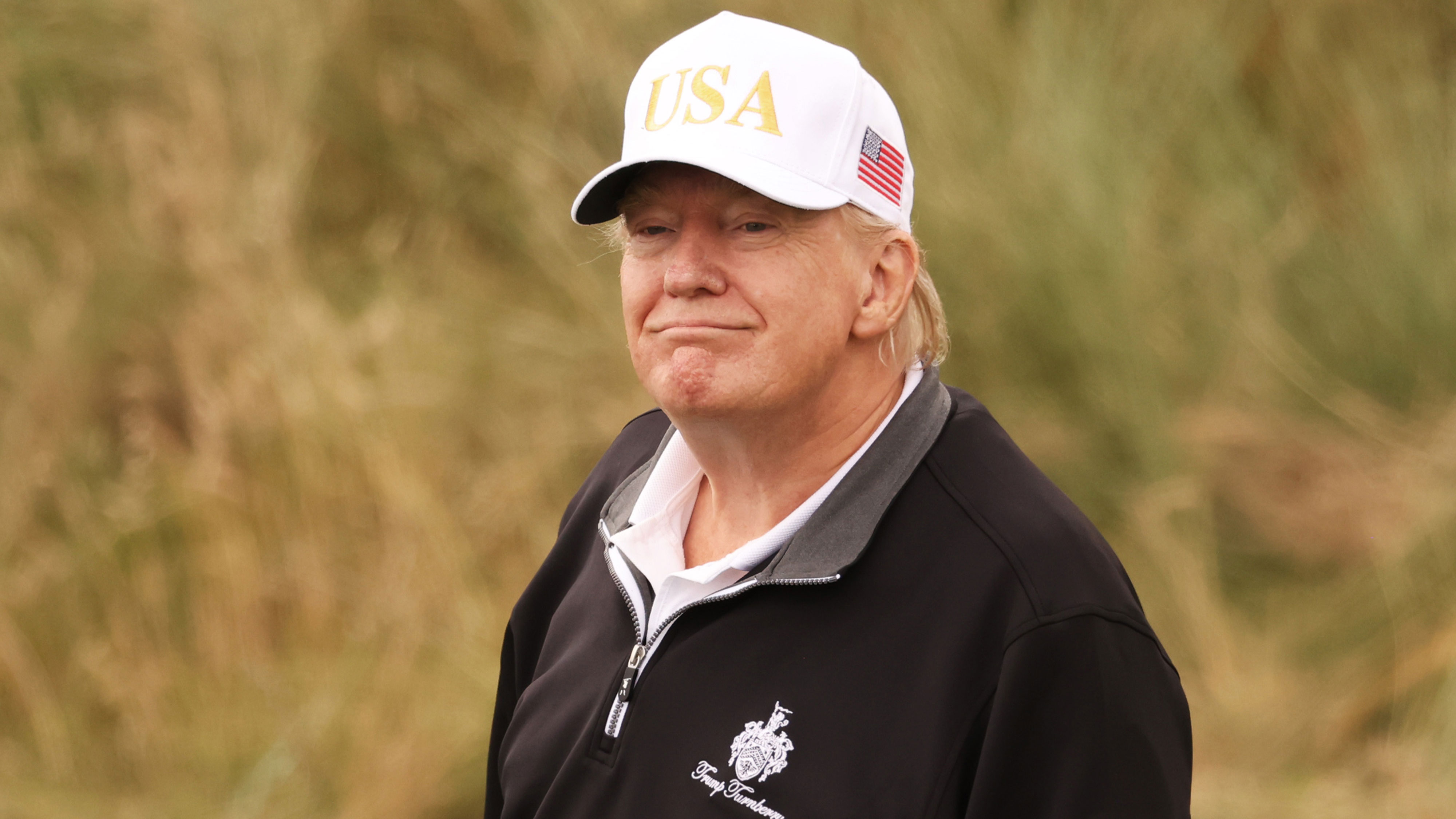 US President Donald Trump plays golf at Trump International Golf Links Aberdeen 