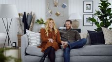 shea mcgee and husband syd sat on sofa in dream home makeover episode
