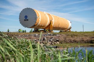NASA’s Space Launch System (SLS) rocket’s core stage, complete with all four RS-25 engines, is transported from NASA’s Michoud Assembly Facility in New Orleans to the agency’s Pegasus barge on Jan. 8, 2020.