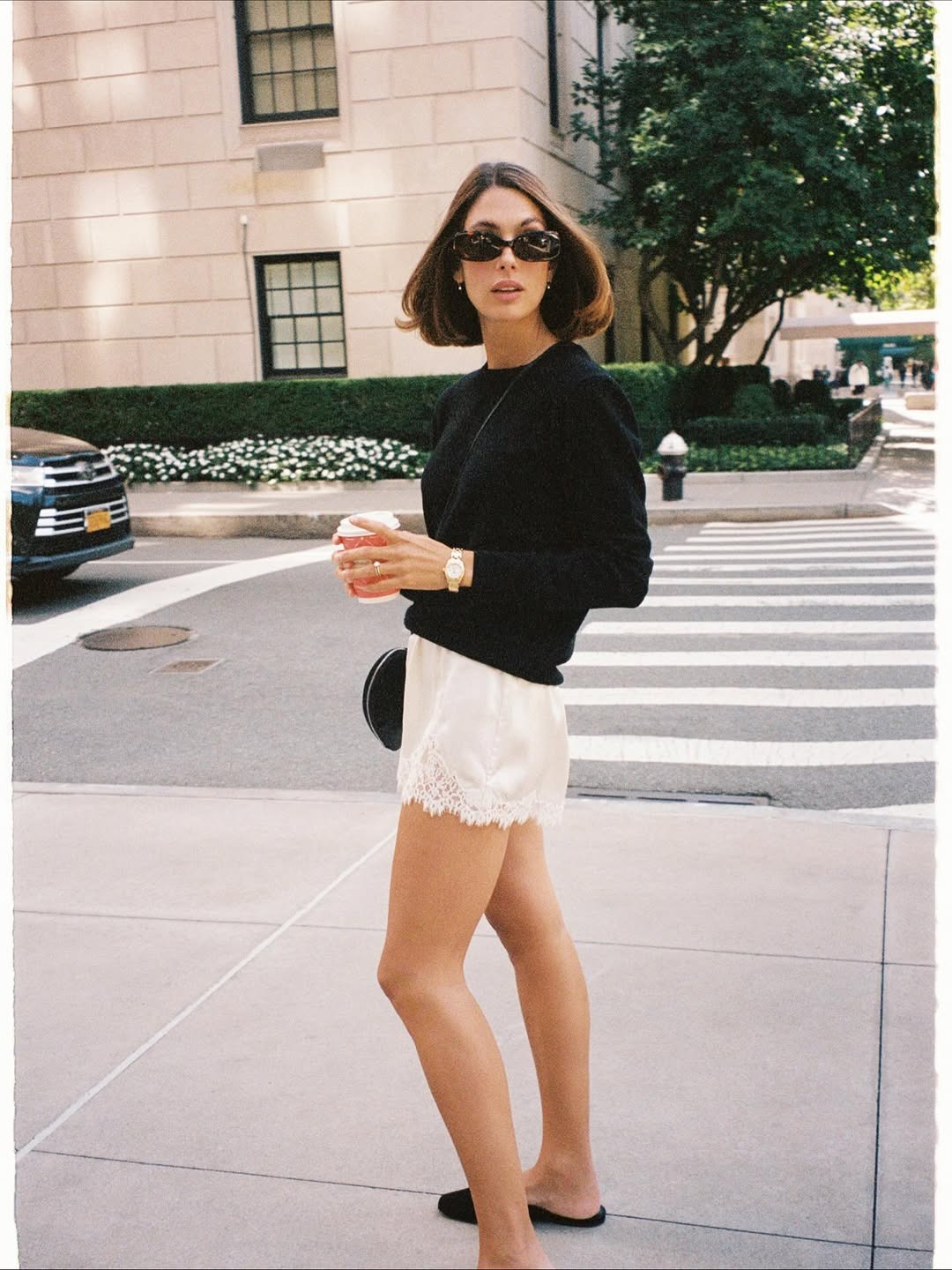 Woman in sweater and lace-trim shorts