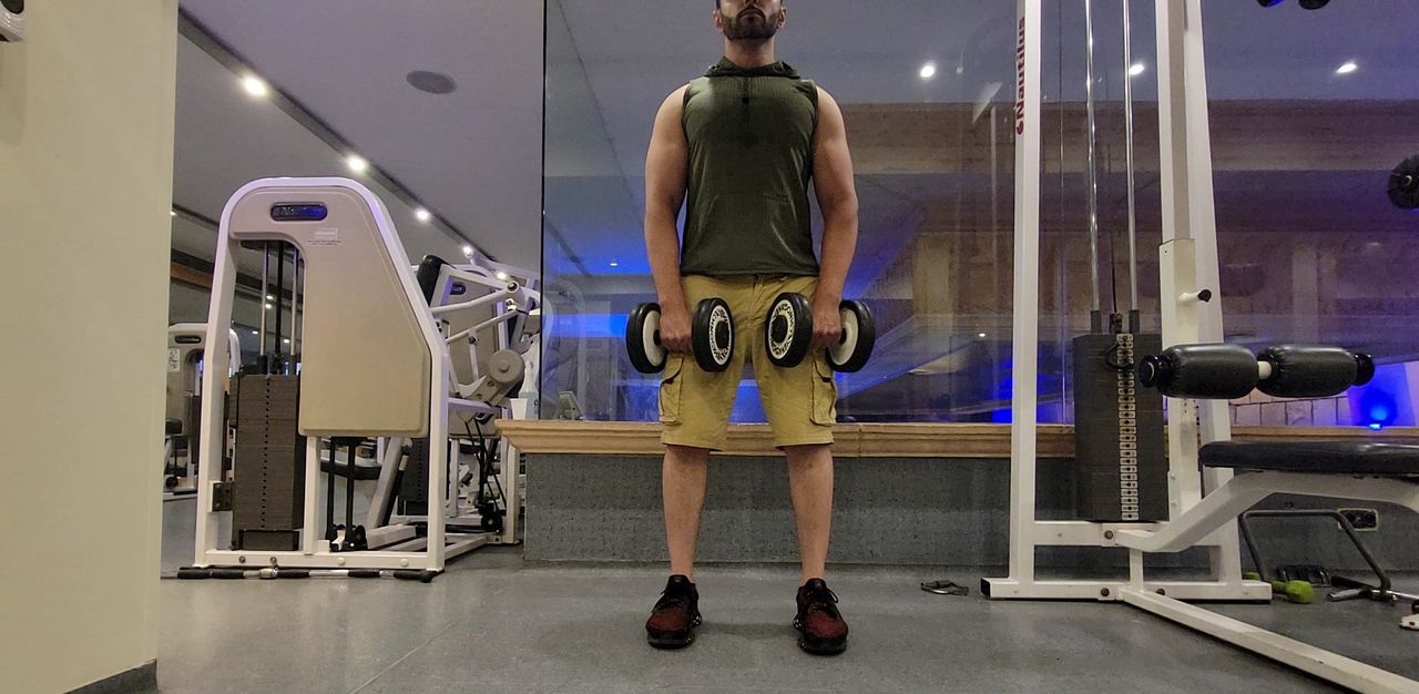 Farzad Aziz completing a dumbbell deadlift