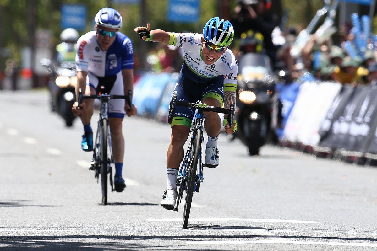 Caleb Ewan punches the air in delight
