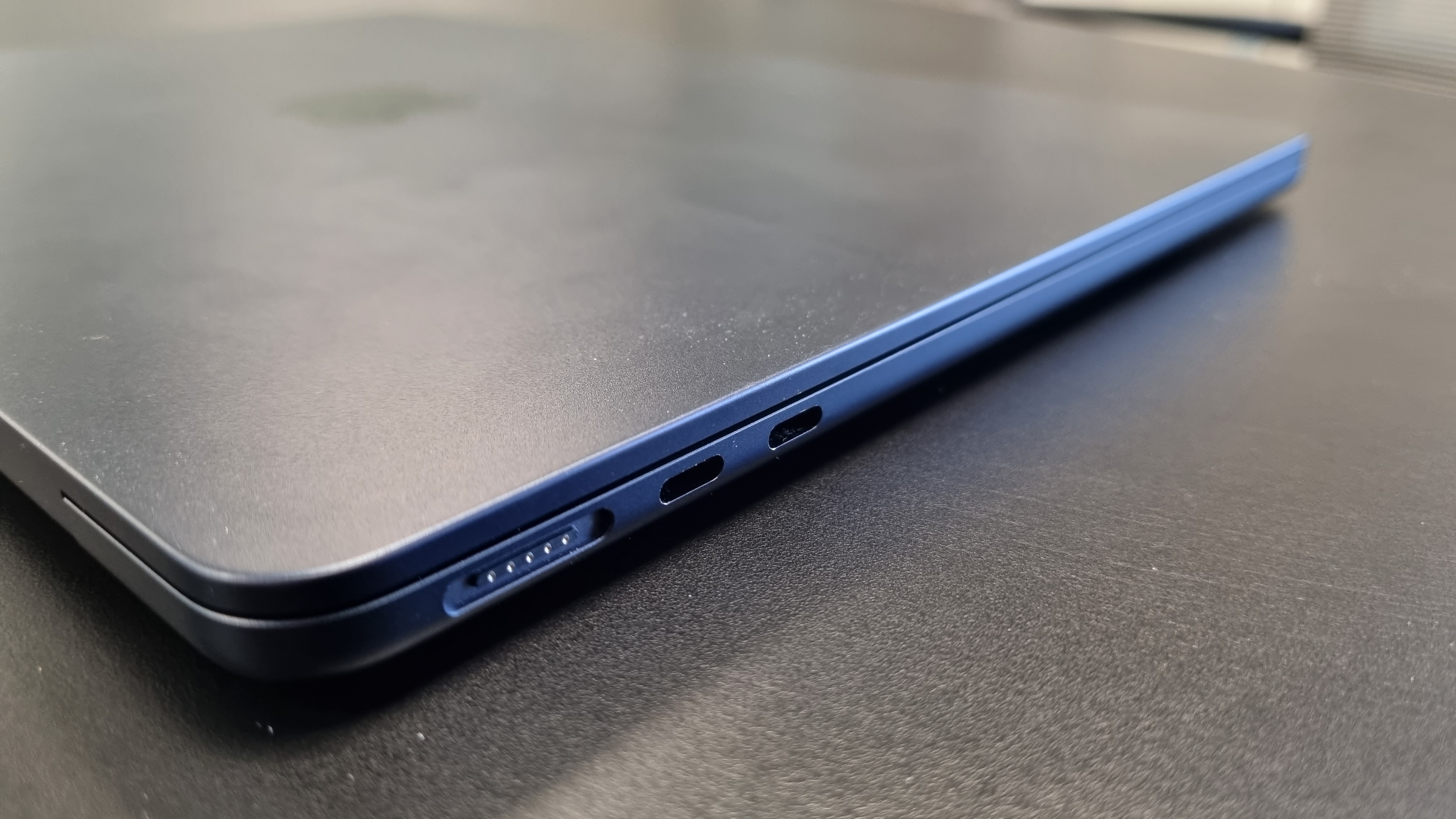 MacBook Air laptop in an office on a black desk