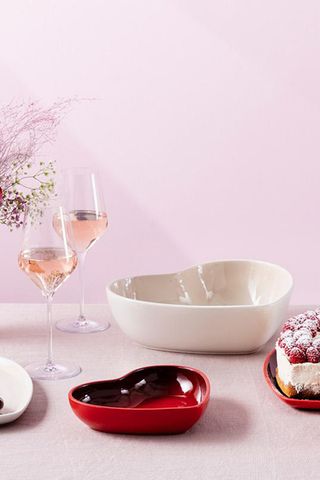 Image of Le Creuset press shot with heart shaped bowls 