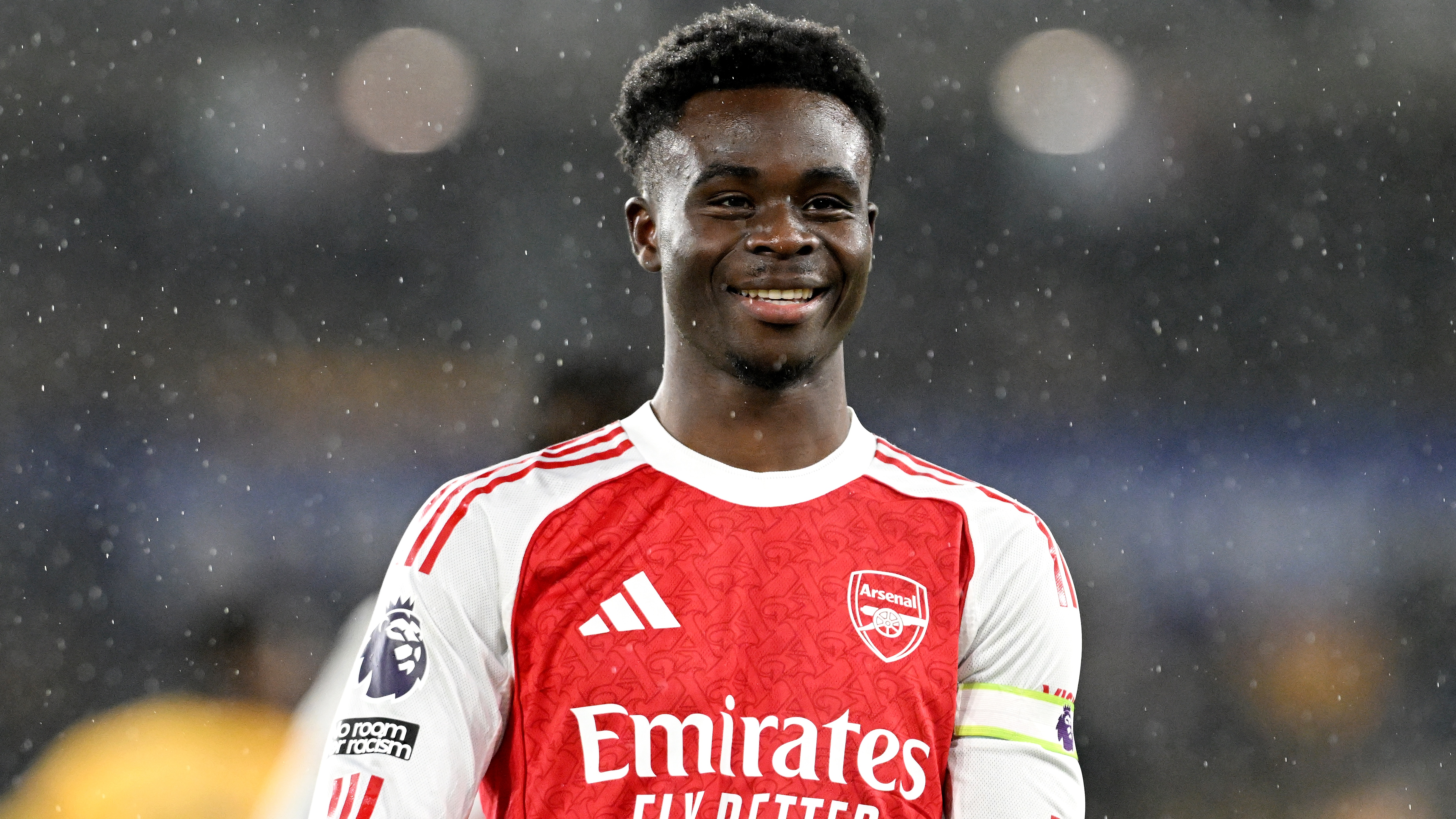 Bukayo Saka of Arsenal celebrates scoring his team's first goal during the Premier League match between Wolverhampton Wanderers and Arsenal at Molineux on February 18, 2026 in Wolverhampton, England.