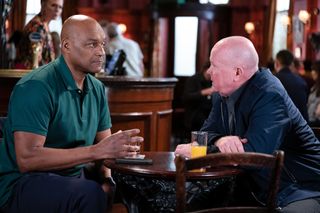 George Knight and Phil Mitchell have a discussion at the Vic over some drinks.