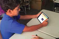 A Wake County elementary student reads anebook on his iPad Mini.