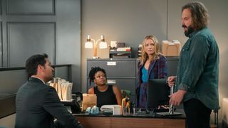 Manuel Garcia-Rulfo as Mickey Haller, Jazz Raycole as Izzy Letts, Becki Newton as Lorna Crane and Angus Sampson as Denis "Cisco" Wojciechowski sitting around an office in The Lincoln Lawyer season 3