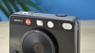 A black Leica Sofort 2 hybrid instant camera