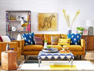 A leather sofa with colorful scatter cushions