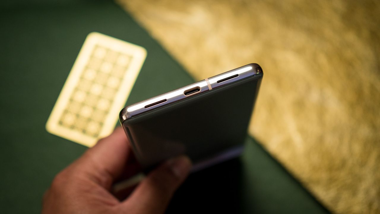 Google Pixel 7 Pro USB port at the bottom against green background