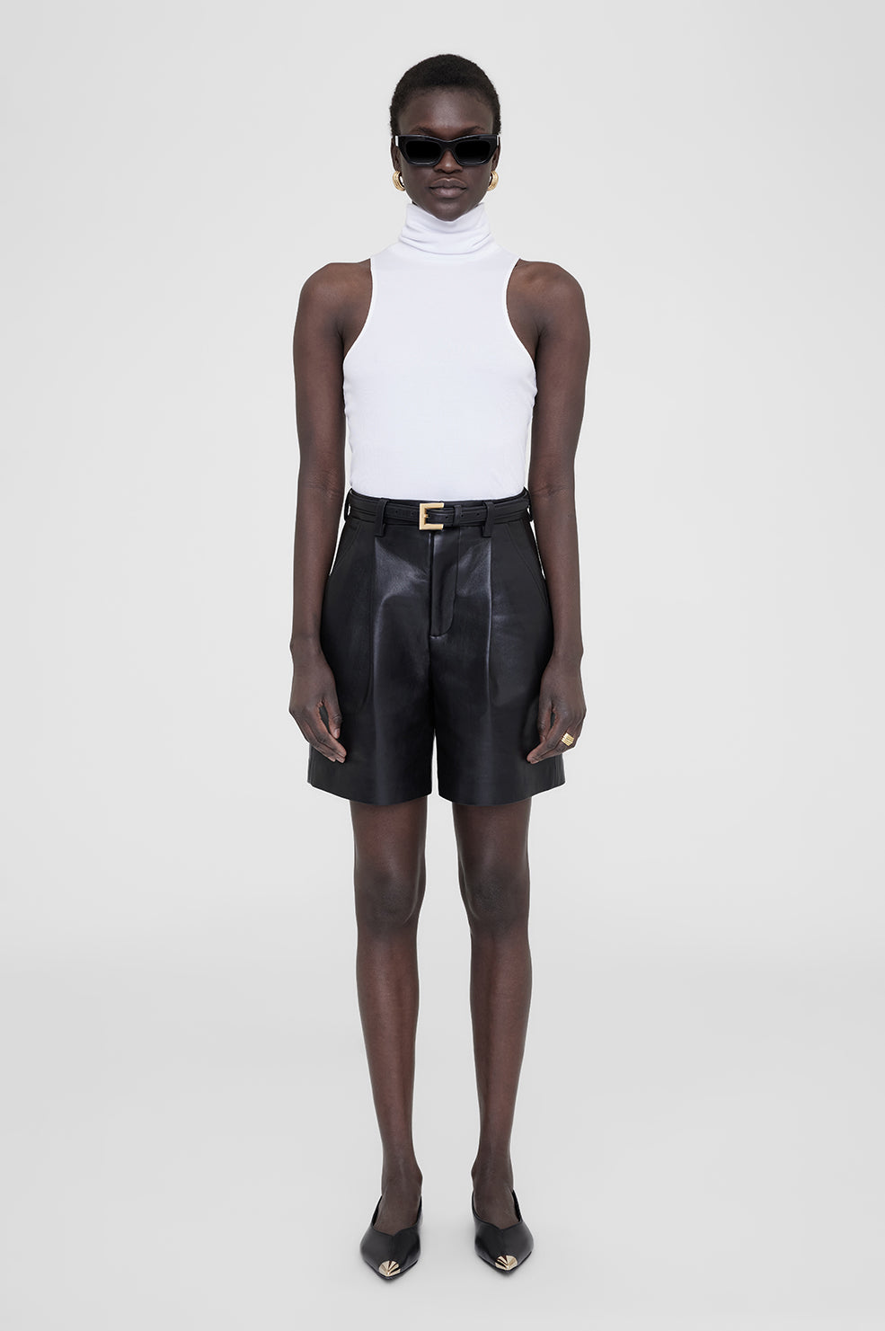a model wears the Anine Bing Jennie top in white