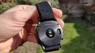 The back of the Garmin Enduro held in hand