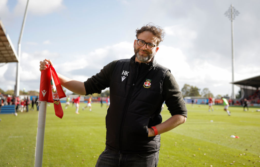 Humphrey Ker, the British comedian, actor and writer who was made executive director of Wrexham by new owners Ryan Reynolds and Rob McElhenney, poses for a picture on the pitch during warm up before the EFL League Two match between Wrexham and Salford City at StoK Cae Ras on October 14th 2023 in Wrexham, Wales (Photo by Tom Jenkins/Getty Images)