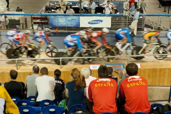 Fans watch the bunch speed past in the first exhibition men's scratch race at the World championships.