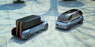 View of Marc Faulhaber’s black and blue VW car concepts on the ground outside during the day