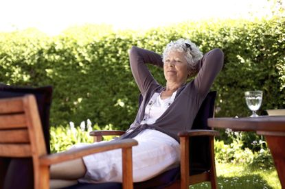 Person Relaxing On Patio Furniture