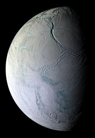 A high-definition image of the surface of Enceladus, including fissures near the north pole (top of the image) called "tiger stripes."