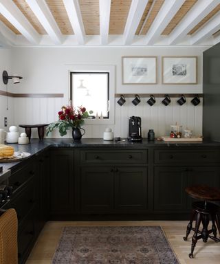 Black kitchen with natural stone countertops