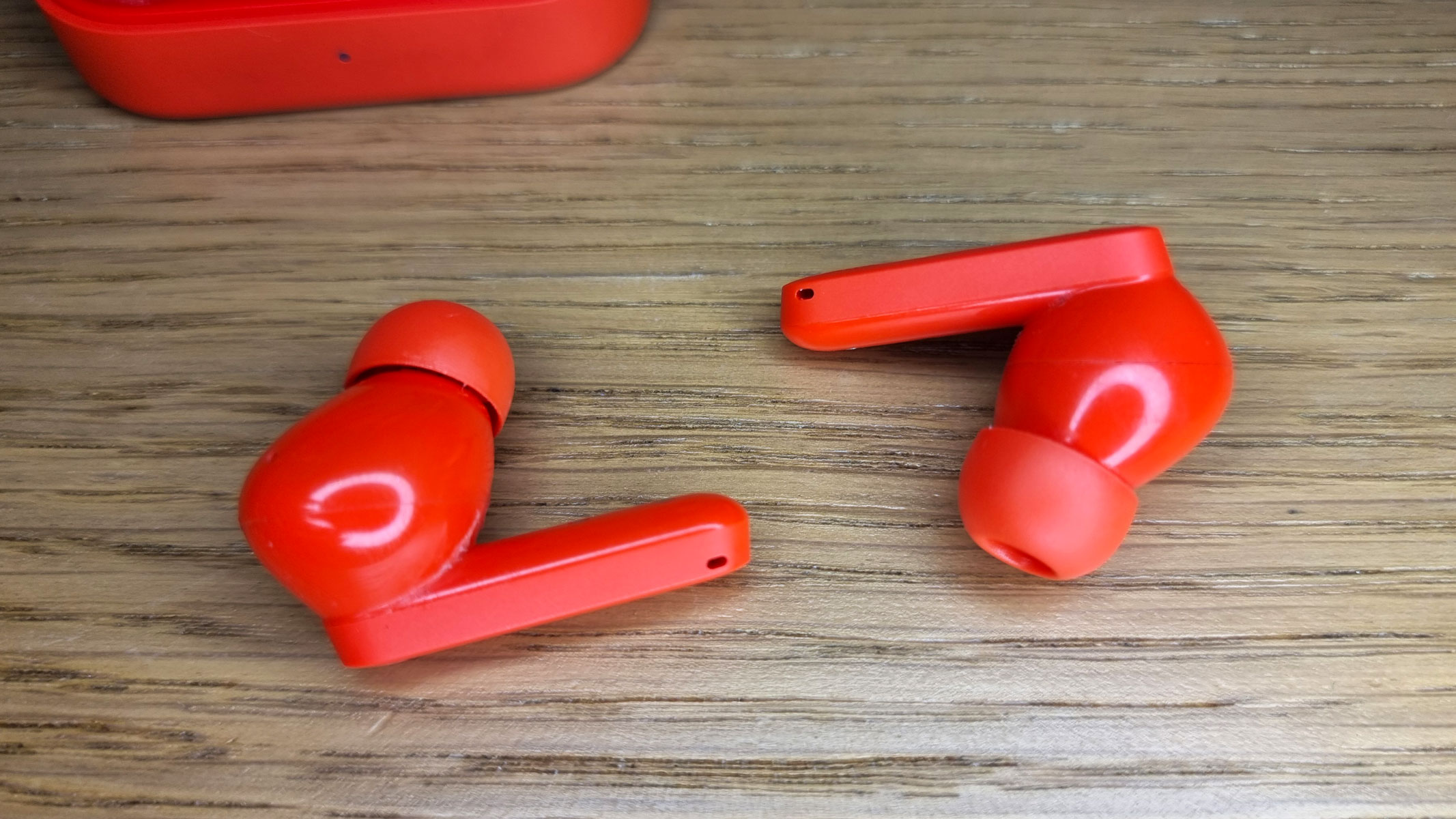 A close-up picture of the CMF by Nothing Buds Pro 2 on a table