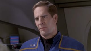 Archer staring at a diplomat in Star Trek: Enterprise. 
