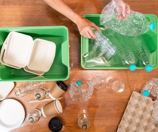plastic and cardboard items being sorted into piles