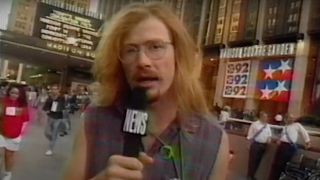 Dave Mustaine standing on the street with a microphone in 1992
