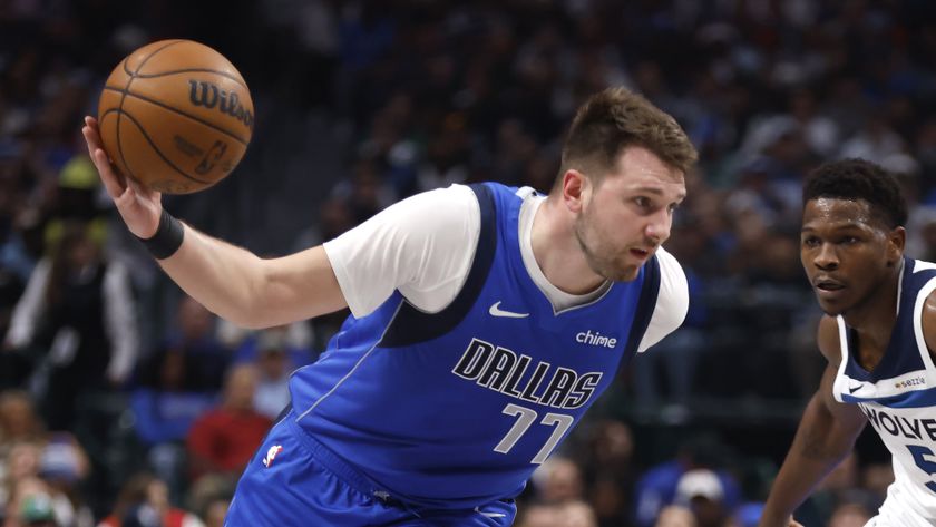 Luka Doncic #77 of the Dallas Mavericks drives inside ahead of the Mavericks vs Celtics NBA game