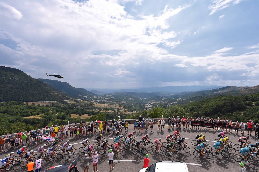 The peloton rolls through the French countryside during stage 15.