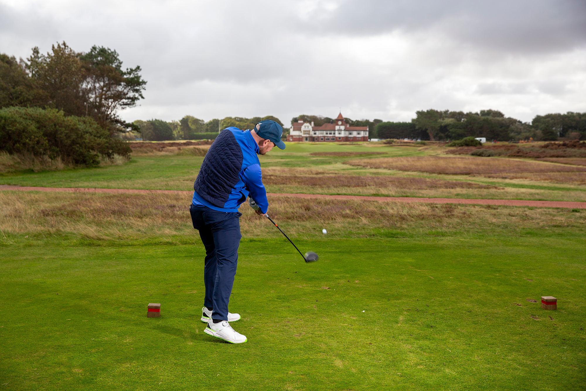 Matt Fryer demonstrating a golf shot with driver where the strike location is centred