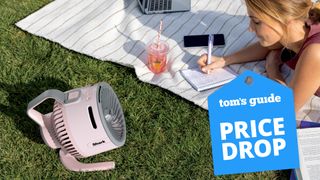 A woman outside using the Shark FlexBreeze fan