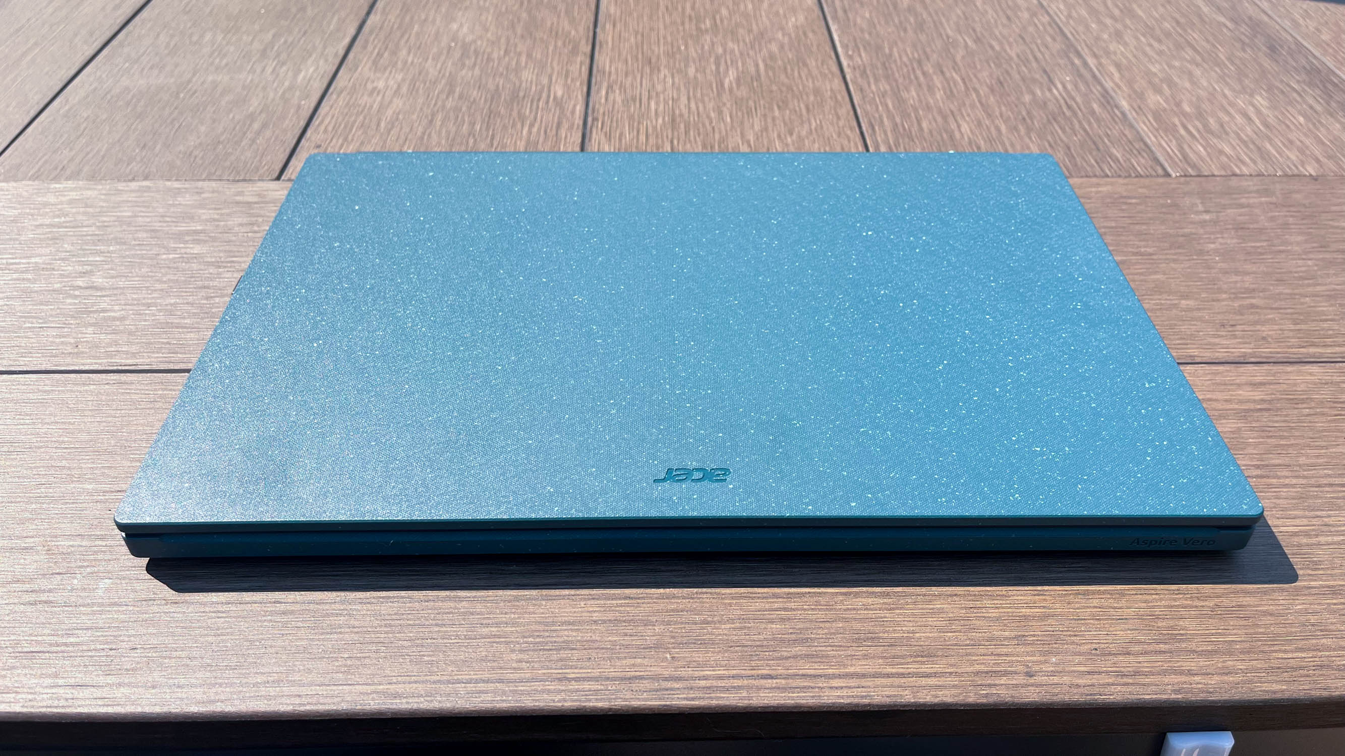 Acer Aspire Vero 15 (2023) outside on an outdoor table