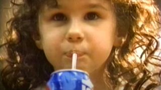 Hallie Eisenberg happily sips her drink for Pepsi.