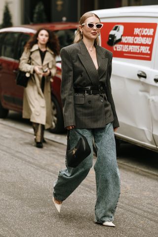 woman wearing blazer, baggy jeans, and pointy heels