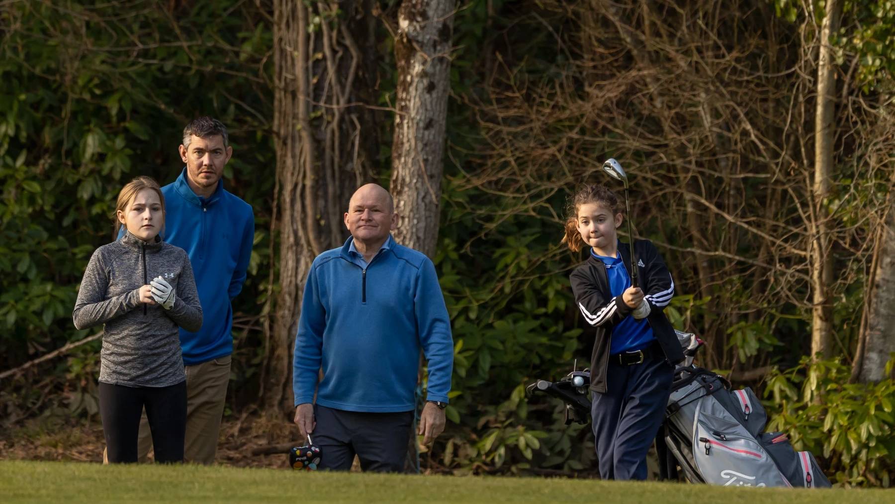 Junior girl hitting a golf shot