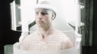 Tom Cruise strapped into his bright white cell in Minority Report.