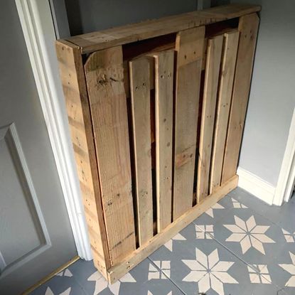 Homeowner upcycles free wooden pallet into a bespoke radiator cover ...