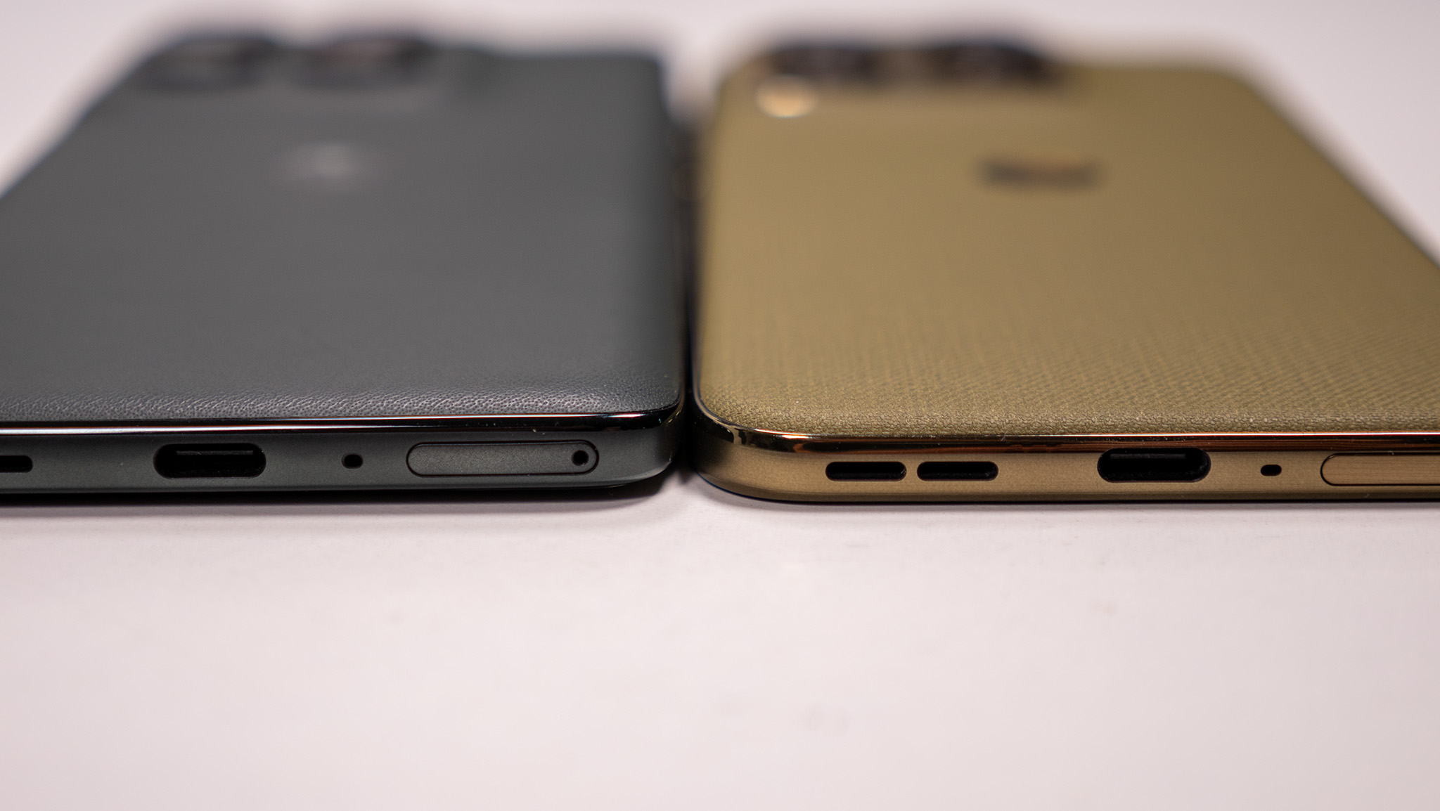 Comparing the olive green Motorola Edge 2026's design with the dark grey Motorola Edge 2025