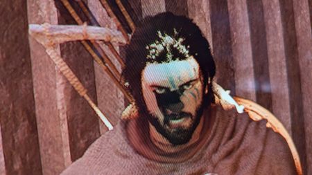 Crimson Desert's main character, Kliff, with a visual glitch on his face.