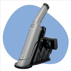 Shark handheld vacuum on a white background with a blue splodge