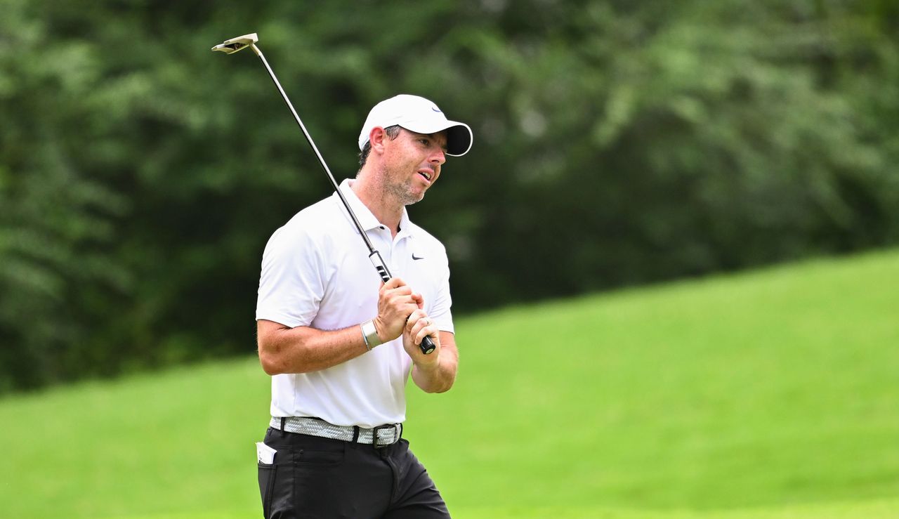 McIlroy reacts to a putt missing