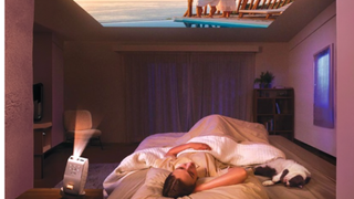 Woman using BenQ GV50 projector