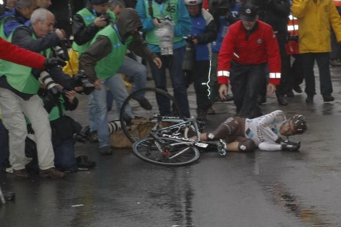 Peraud (Ag2r) had no where to go but onto the ground and hurtled towards photographers