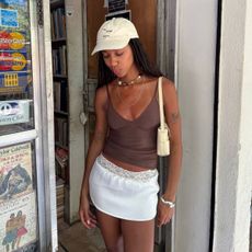 Amaka wearing white mini skirt 