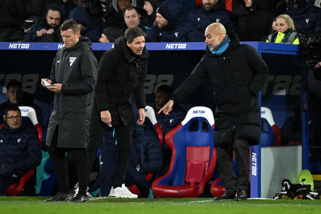 Pep Guardiola, Manager of Manchester City, points at the fourth officials foot as Oliver Glasner, Manager of Crystal Palace looks on during the Premier League match between Crystal Palace FC and Manchester City FC at Selhurst Park on December 07, 2024 in London, England.