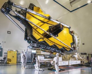 james webb space telescope folded up in a clean room
