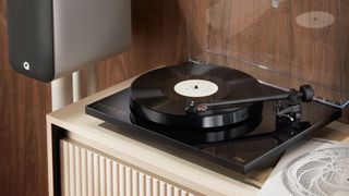 Goldring GR3 turntable on shelf next to speaker